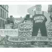 B+W photo of the General Foods float in Hoboken Centennial celebration parade on Washington St. near 1st St., Hoboken, 1955.