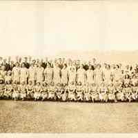 Sepia-tone panoramic photo: Employees of Shoup-Owens, Inc., posed on the roof of the main building at 1100 Adams St., Hoboken , n.d.