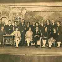 Sepia-tone group photo of the cast of an amateur theatrical production of the Hudsonia Club, Hoboken, no date. ca. 1920.