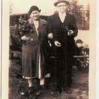 Color photocopy of photo of August & Gesina Engelbart standing in front of an automobile, no place, no date, ca. 1940.