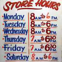 Sign: Store Hours. From interior of Apicella