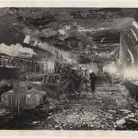 B+W photo of firemen & policeman inspecting wreckage in Holland Tunnel shortly after chemical truck explosion, ca. May 13 or 14, 1949.