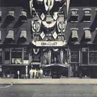 B+W photo of United Decorating Co., 421 Washington St., Hoboken on 35th anniversary, 1934, with 4 family members outside store.