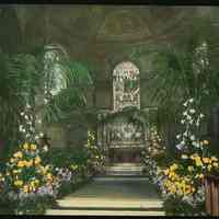Lantern slide, color, of a church interior with floral decorations, used for promotional display in Hoboken, no date, ca. 1920.
