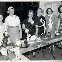 B+W photo of six women at Brandt School art exhibit, (Hoboken), n.d., probably May 13, 1958.