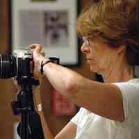 Digital images, 4, Caroline Carlson photographing her work in exhibit, Hoboken in the 1970s, at the HHM, Hoboken, June 24, 2007.