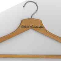 Wood coat hanger stamped "Holland-America Line." [Hoboken], no date circa 1950-1963.