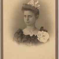 Cabinet photo of a young woman posed in photographer