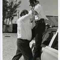          3: Dan Blocker (left) lifting a police officer
   