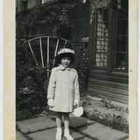 B+W photo of Mary Anne Amoroso, Easter Sunday, in yard at 818 Bloomfield St., Hoboken, 1953.