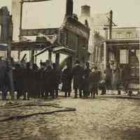 Sepia-tone photo of exterior view of the aftermath of fire at John Schmalz