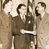 Digital image of b+w photo of Mayor Fred DeSapio receiving check from Charles Regiban (sic - probably Kaegebehn), Hoboken, no date, ca. 1947-49.