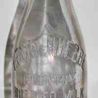 Bottle, milk: Henry Huebbe, Country Bottled Milk. Hoboken & Union Hill (N.J.). One Quart Trade Mark. N.d., ca.1906-1914.