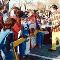 Color photo of the 1985 Hoboken Ragamuffin Parade with Mayor Tom Vezzetti greeting children in costume, Hoboken, October, 1985.