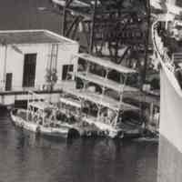          detail right of work barges near bow of freighter
   