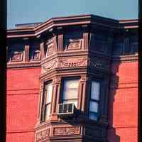 Color slide of detail view of cornice and bay windows at a building on 11th between Bloomfield and Garden