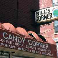 Color photo of two signs for Candy Corner (formerly Bill