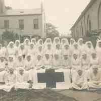 Sepia-tone group photo of a nursing class in the yard of the Martha Institute, on 6th St. between Park Ave. & Garden St., Hoboken, no date, ca. 1920.