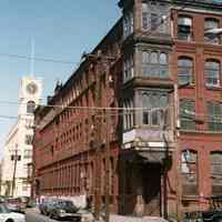 Color photo of former Keuffel & Esser Co. east building, corner Grand & Third Sts., Hoboken, n.d., ca. Apr. 1982.