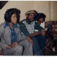 Digital image of color photo of Marilyn "Susie" Richardson, a man and another woman in an Adams Street home, Hoboken, no date, circa 1970