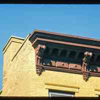 Color slide of close-up view of cornices, brackets, friezes, chimney and window heads on a building at an unidentified location