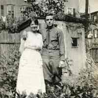 B+W photo of Rose Beck & fiance George Jaxel in his U.S. Army uniform, backyard garden, 600 Monroe St.?, Hoboken, Sun., Aug. 18, 1918.