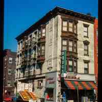          Color slide of eye-level view of 1000 Washington on the NW corner of Washington & 10th occupied by Tucker's Drugs with a produce truck parked on 10th picture number 1
   