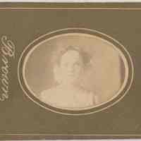 Sepia-tone photo of an unidentified young woman posed in studio, Hoboken, no date, ca. 1890-1910.