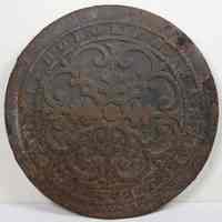 Cast iron coal chute or drain cover lettered "Mansfield & Scudder Hoboken" with arabesque decoration. N.d, ca.1880-1900.