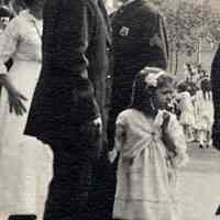          detail center: young girl, man, and police officer
   