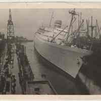 Digital photos, 2, of the M.S. Oslofjord, Norwegian-America Line, seen listing in drydock, Hoboken, n.d., ca. Jan. 10, 1957.