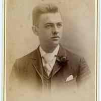 Cabinet photo of young man posed in photographer