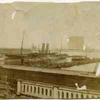 Sepia-tone photo of piers destroyed in June 1900 pier fire, Hoboken.