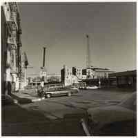 B+W photo of a view from River St. & Hudson Place looking east at Erie Lackawanna Terminal, Hoboken, no date, [1976].