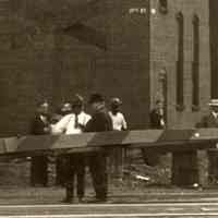          detail left center with railroad crossing sign; street signs on building
   