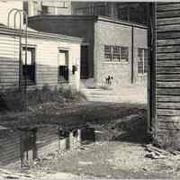 B+W photo of the rear exterior of waterfront buildings just south of the Maxwell House Coffee plant, Hoboken, 1972.