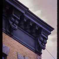 Color slide of detail view of cornice, brackets, frieze and window head at 704 Grand between 7th and 8th