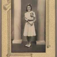 Sepia tone photo of Mildred Avantario posed for graduation photo, Hoboken, n.d., ca. June 1940.