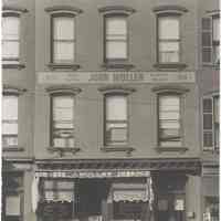 Digital image of black-and-white photo of the exterior of Muller business at 930 Washington Street, Hoboken, no date, ca. 1940.