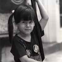 B+W photo of young girl with broom as part of "Sweep a Mile", Hoboken, April 11, 1980.