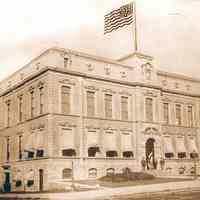 B+W photo of City Hall, flag painted in photo, ca. 1893-1909.