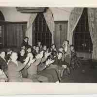 B+W photo of boys on folding auditorium seats for program at Hoboken YMCA, Hoboken, n.d., ca. 1945-1955.