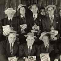 B+W group photo of men in suits holding Wheaties boxes, some wearing awards for shooting, Hoboken?, no date, ca. 1943