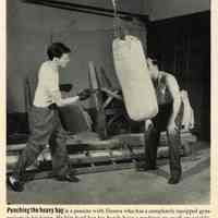         detail pg 62, bottom photo: Punching the heavy bag (home gymasium)
   