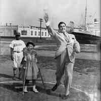 B+W photo of Mayor John J. Grogan throwing a ceremonial pitch at the Little League Field, Hoboken, no date, ca. 1955-1960.