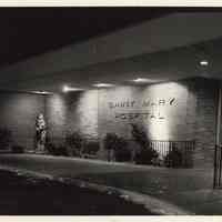 B+W photo of main entrance at night on Willow Avenue of Saint Mary Hospital, Hoboken, no date, ca. Dec. 1977.