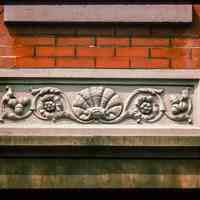 Color slide of close-up view of decorative tile on a building on Bloomfield between 10th and 11th