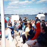 Color photo of the passengers on Hudson River ferry looking north, Hoboken 1989.