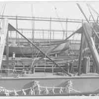 B+W photo of a launch on a deck with repair rigging in foreground, Hoboken, no date, ca. 1940.