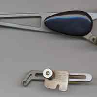          top view of scriber with accessory letter size adapter separate
   